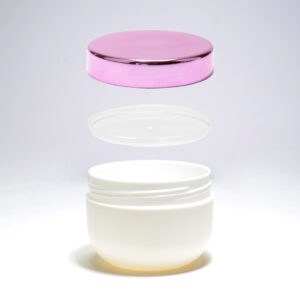 A 200ml PP Jar for personal care with its pink lid floating above and a transparent inner lid set aside against a white background.