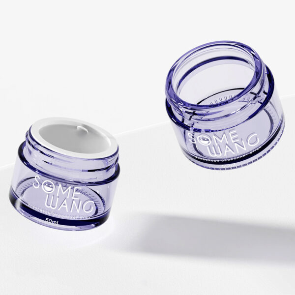 Two elegant transparent jars labeled "SOME WANG" sit on a white surface; one has a sleek screw cap, and the other is open.