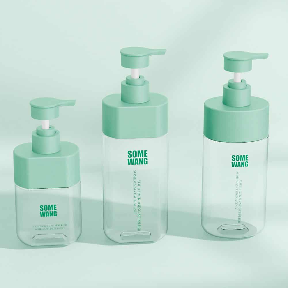 Three empty 500ml transparent PET lotion pump bottles with green lids labeled "Some Wang," arranged by size, against a light green background.