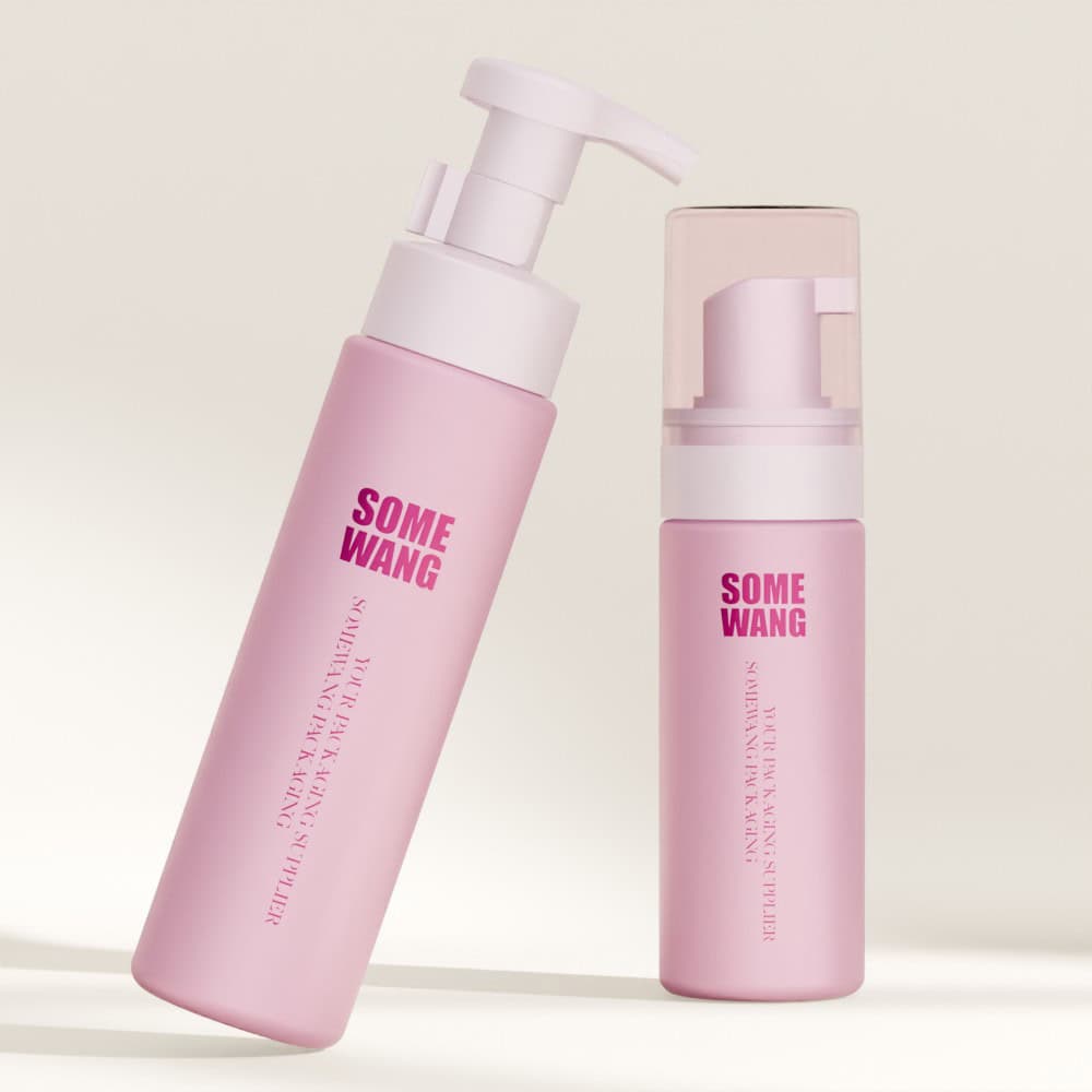 Two pink skincare bottles (50ml & 70ml) labeled "PET foam pump bottle" stand on a light background. The 50ml has a clear cap.