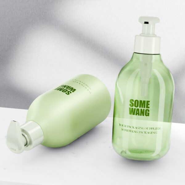 Two green 240ml clear matte PET shampoo bottles with treatment pumps are on a white surface, against a gray gradient background.