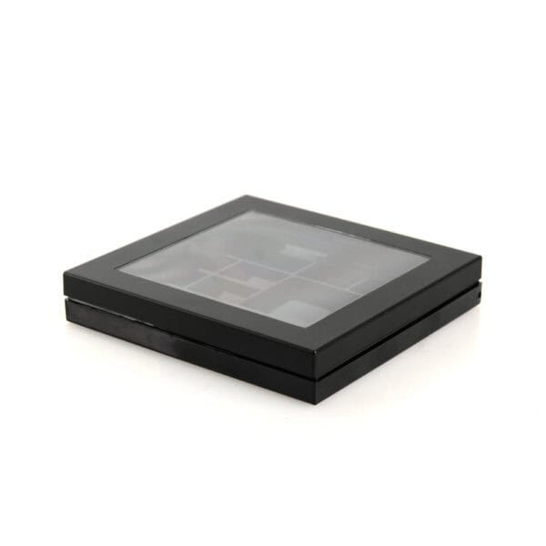 A black plastic rectangular case with a transparent lid, revealing a SWC-CPC013 3-pan square eyeshadow palette inside.