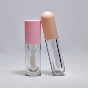 Pink and beige lipstick gloss tubes with clear bases, showcasing modern cosmetic packaging design.