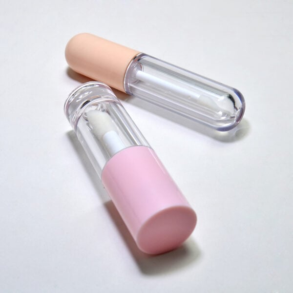 Luxurious skincare serum bottles with pastel pink and beige caps, transparent bodies showing the white serum inside, on a white background. Perfect for beauty, skincare, and cosmetic products.