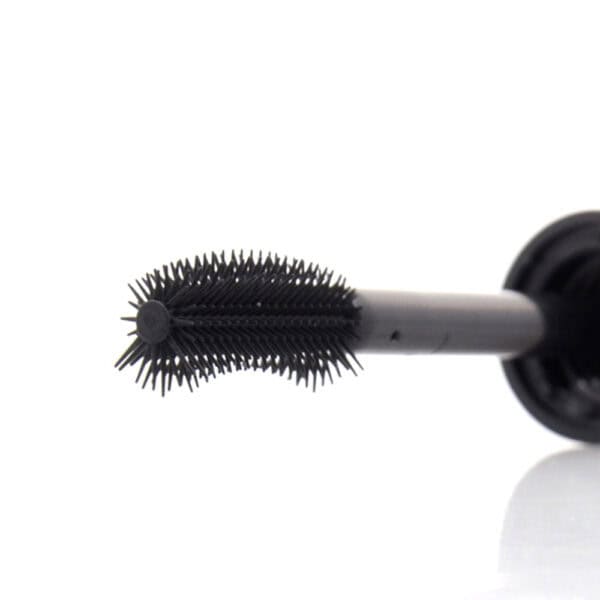 Close-up of SWC-CMA019 plastic mascara bottle with curved, spiky brush on white background.