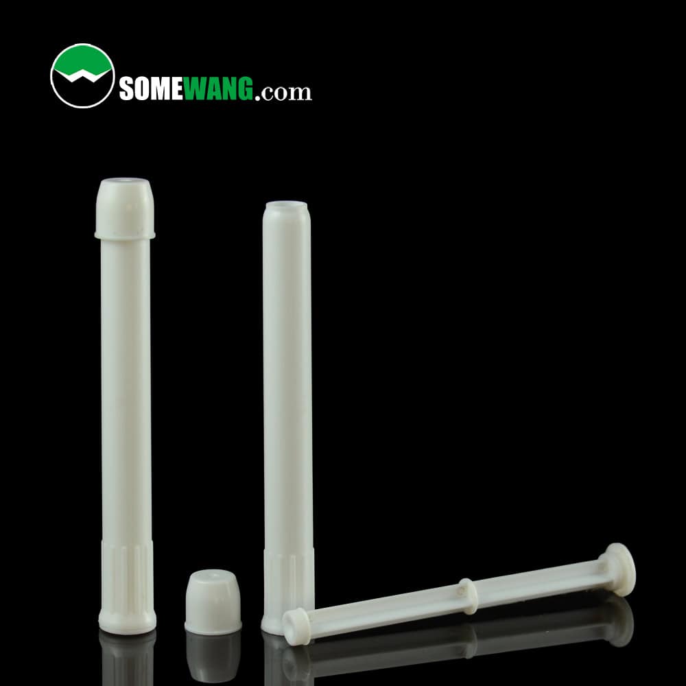 Three white plastic tubes with caps, resembling 2ML stain remover pens, against a black background. Text "SOMEWANG.com" in the top left.