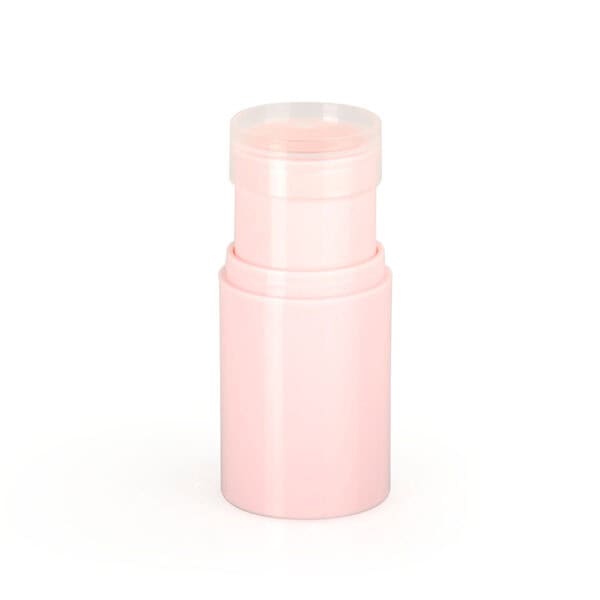 A light pink cylindrical container, like an SWC-CFC006-4 empty concealer stick, stands upright with a clear cap on a white background.