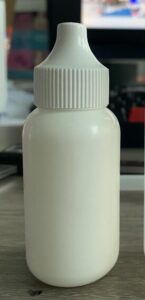 Piccola bottiglia cosmetica