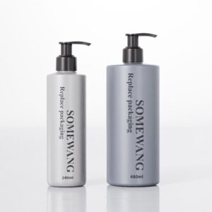 Two gray shampoo bottles with pump tops sit on a reflective surface. "SOMEWANG" (240ml) is smaller than the 480ml one. Both say "Replace packaging.