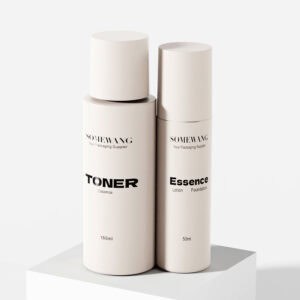 Two minimalist cylindrical cosmetic bottles on a white surface, including a sleek pump bottle labeled "Essence Lotion.