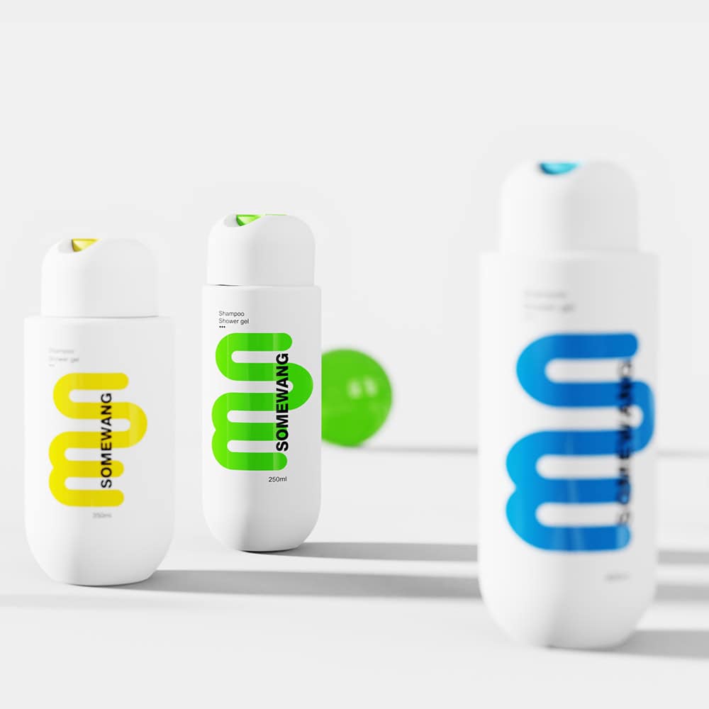 Three sleek white bottles with vibrant text sit on a light gray surface, beside a striking green ball in the background.