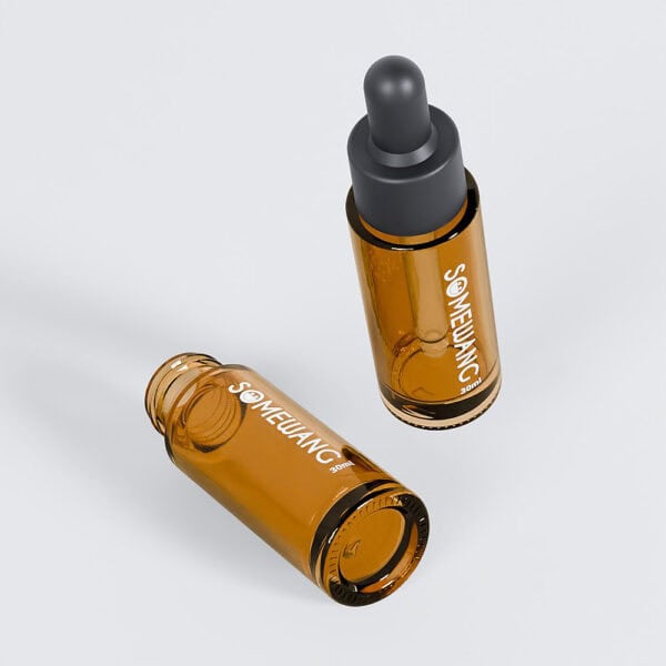 Two 30ml amber dropper bottles with pipette caps are on a gray background, labeled "Something." One stands, the other lies down.