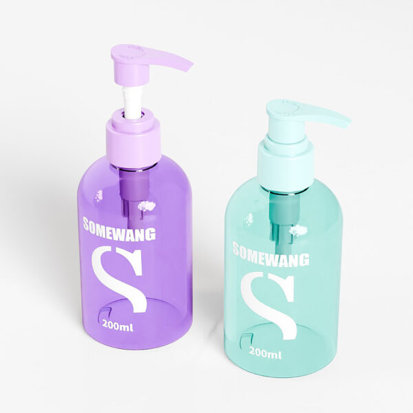 Two 200ml "SOMEWANG" pump bottles in purple and light blue PET plastic sit elegantly on a white surface, ideal for hand sanitizer.