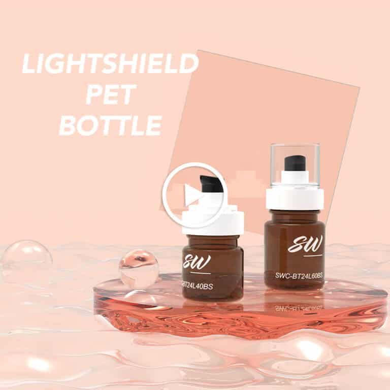 Two amber pump bottles sit on a clear surface with "LIGHTSHIELD PET BOTTLE" above; a play button icon is centered on the image.