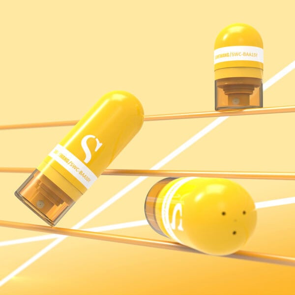 Wheat straw, capsule-shaped, yellow tubes rest on a tilted grid backdrop. These eco-friendly cosmetic tubes are both aesthetic and sustainable.