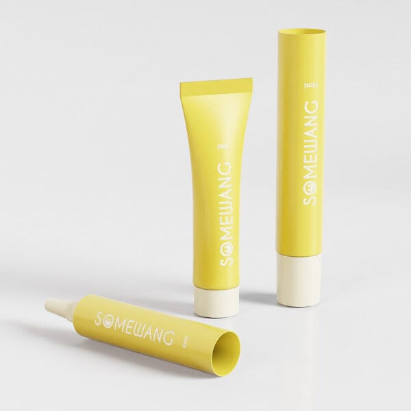 Three yellow "Somewang" cosmetic tubes with white caps, in D16mm and D40mm designs, rest on a white surface.