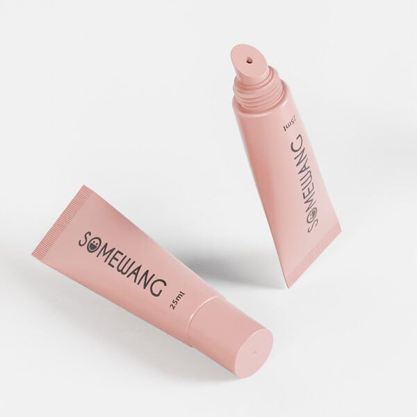 Two sleek pink tubes from the D19mm Round PE line, labeled "SOMEWANG" with 25ml capacity, resemble elegant lip gloss designs.