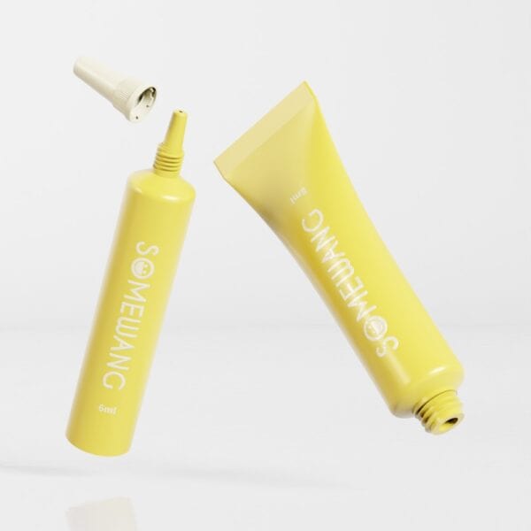 Two yellow SOMEWANG D40mm squeeze tubes made of Plastic PE Round Tube are shown on a white background, one cap floating above.