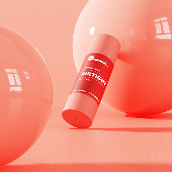 A red cylinder labeled "AIRTIGHT" stands on an orange surface with large reflective spheres, resembling a deodorant stick package.