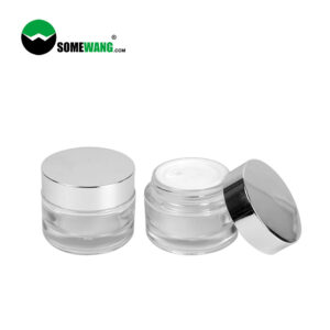 Two elegant 50g Round Glass Jars with sleek silver lids: one closed, the other showing luxurious white face cream.