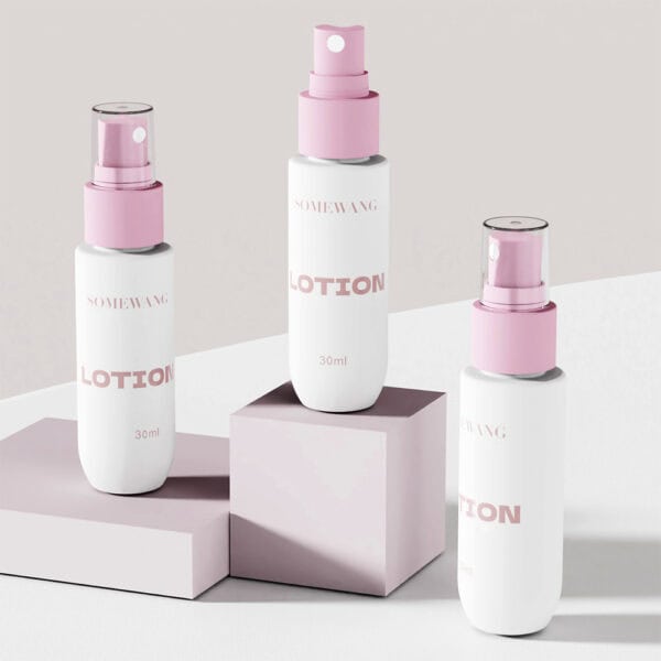 Three 30ml PET mist spray bottles with pink caps are displayed on pastel blocks against a neutral background.