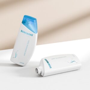 Two white 100ML HDPE shampoo bottles with blue flip-top caps say "SOMEWANG" in blue; one is upright, the other flat.