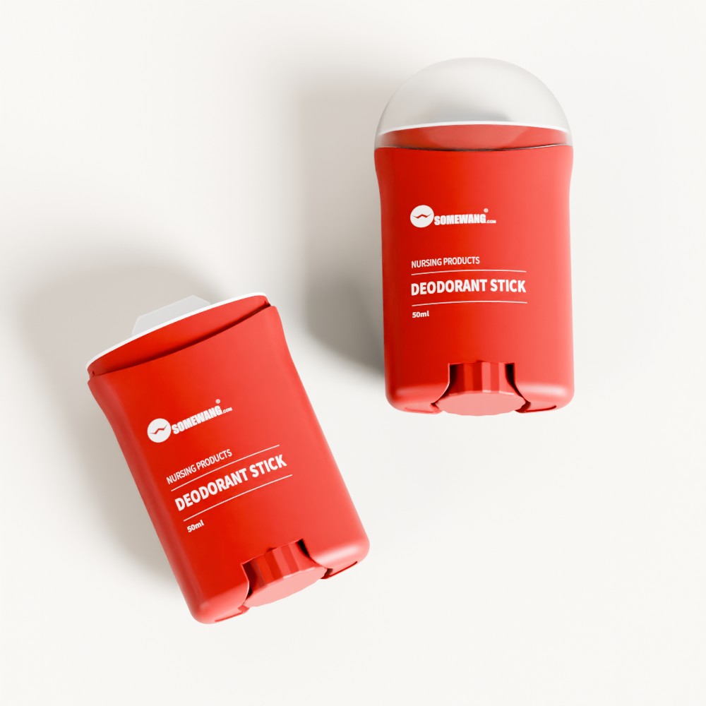 Dua batang deodoran merah dengan penutup putih, berlabel "STICK DEODORANT," duduk di atas permukaan putih—satu tegak, satu baring.
