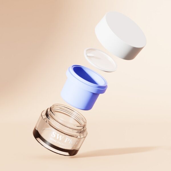 Glass cosmetic jar with blue insert, inner lid, and white outer lid in a floating exploded view on beige background.