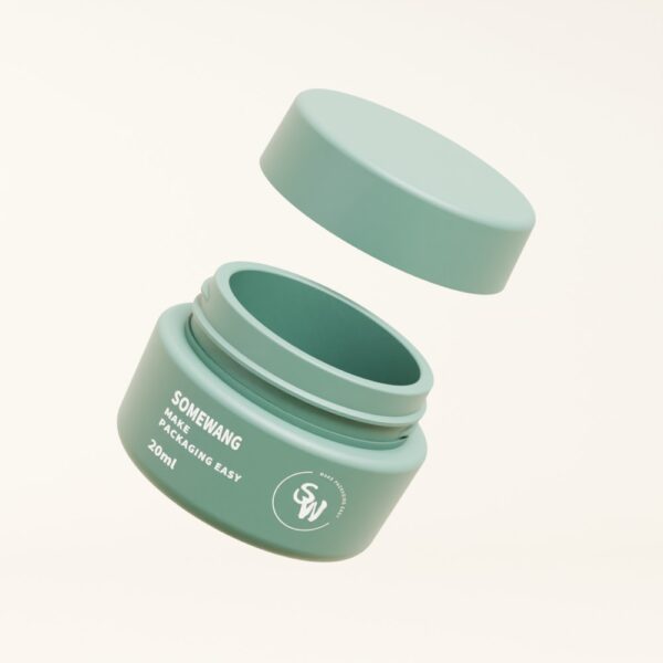 Un pot bleu sarcelle "SOMEWANG" de 20 ml avec un couvercle à vis flottant sur un fond beige clair.