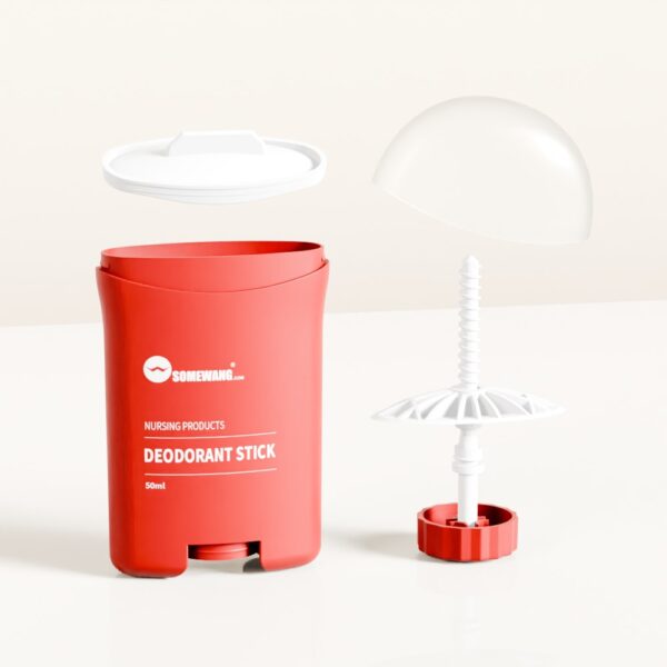 Красный дезодорант-карандаш с надписью «DEODORANT STICK» и белой крышкой, а также разобранный дозатор лежат рядом.
