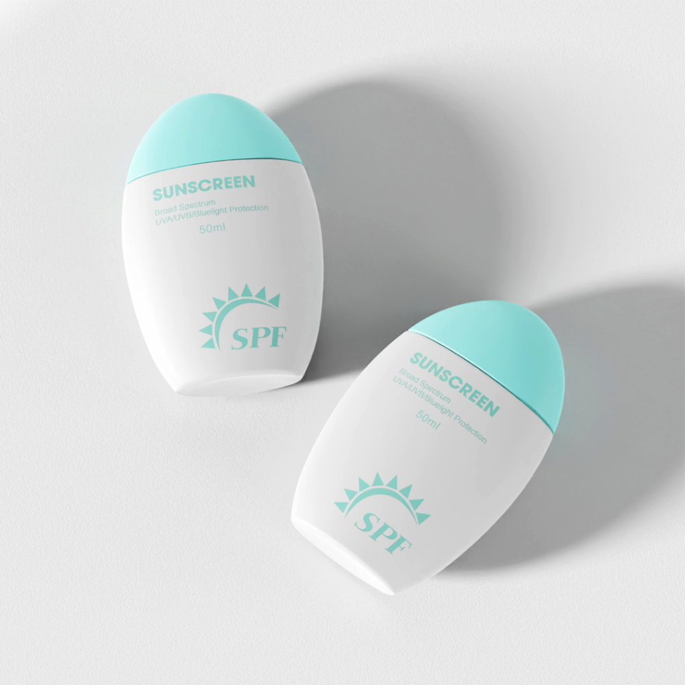 Two white 50ml PE sunscreen bottles with turquoise caps and "SPF" labels sit on a light surface, casting soft shadows.
