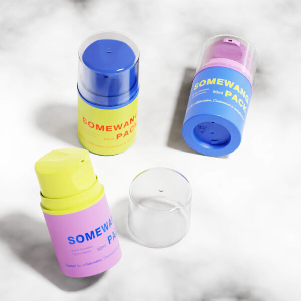 Four labeled 50ml airless PP lotion bottles and two caps are displayed on a light marble surface.