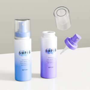 Two custom 50ml/60ml PET bottles, blue to purple gradient, one clear cap, one snap sprayer with detached nozzle.