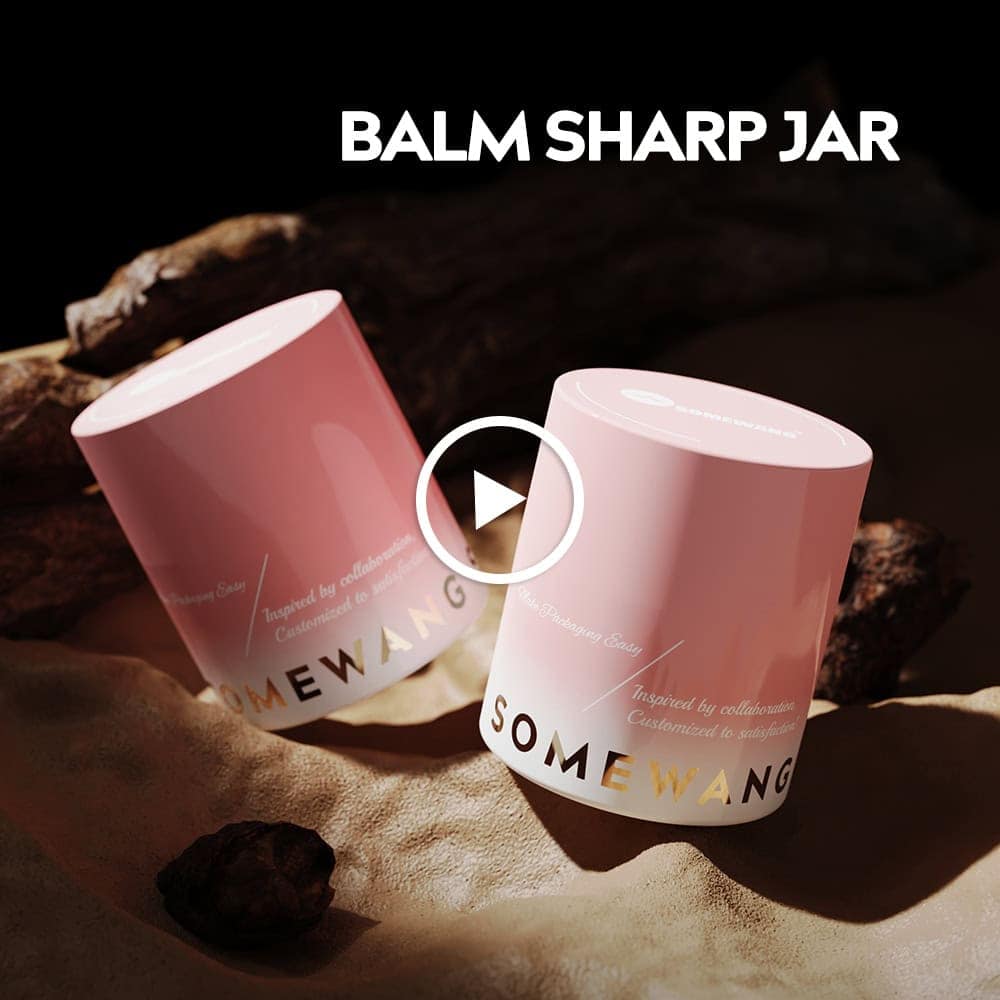 Two pink "SOMEWANG" balm jars on sand with rocks, under the text "BALM SHARP JAR.