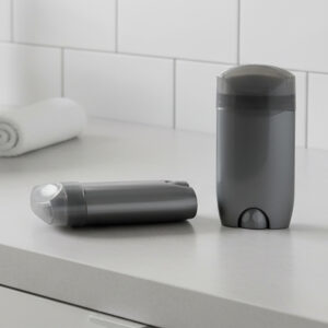 Automatic soap dispenser with touchless motion sensor in a modern bathroom setting.