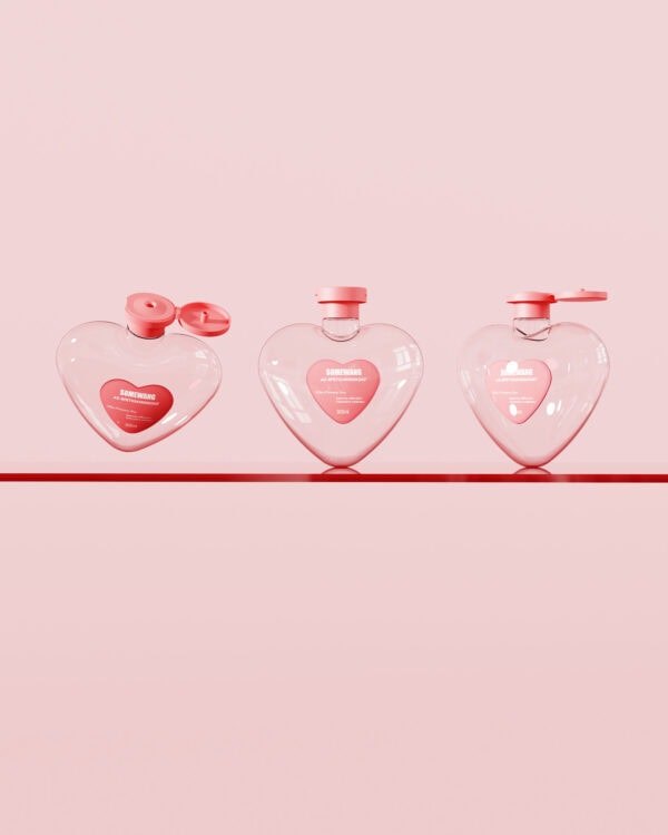 Elegant heart-shaped perfume bottles with pink caps, featuring a cute, romantic design perfect for modern fragrance collections and beauty product displays.