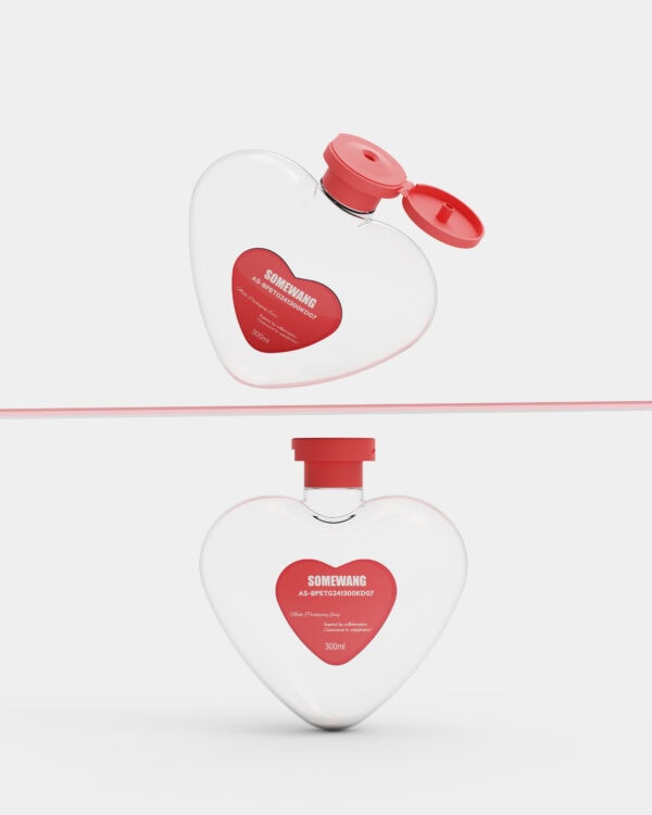 Heart-shaped perfume bottle with pink lid and red heart label, sitting on a sleek white background highlighting its elegant, playful design perfect for gift and personal use.
