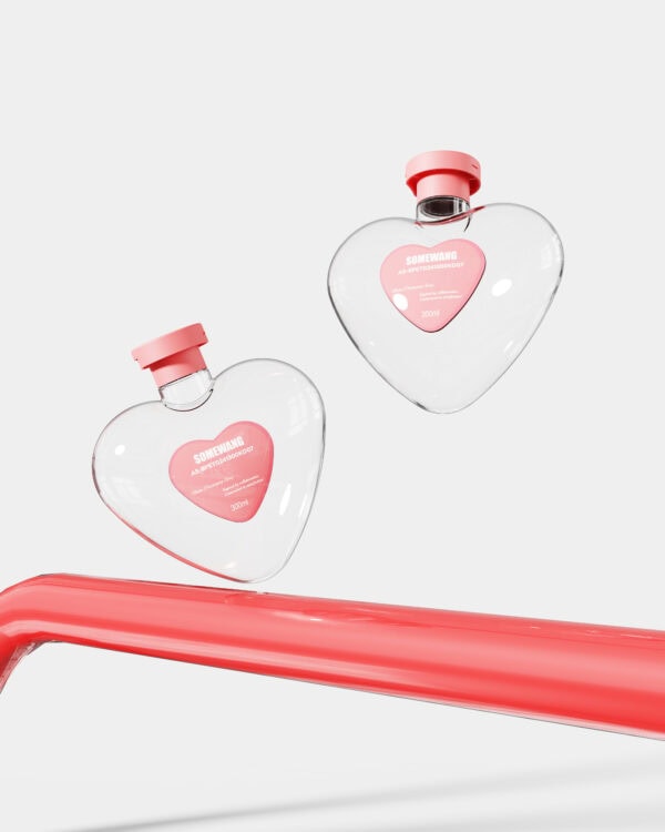 Cute heart-shaped perfume bottles with pink caps.
