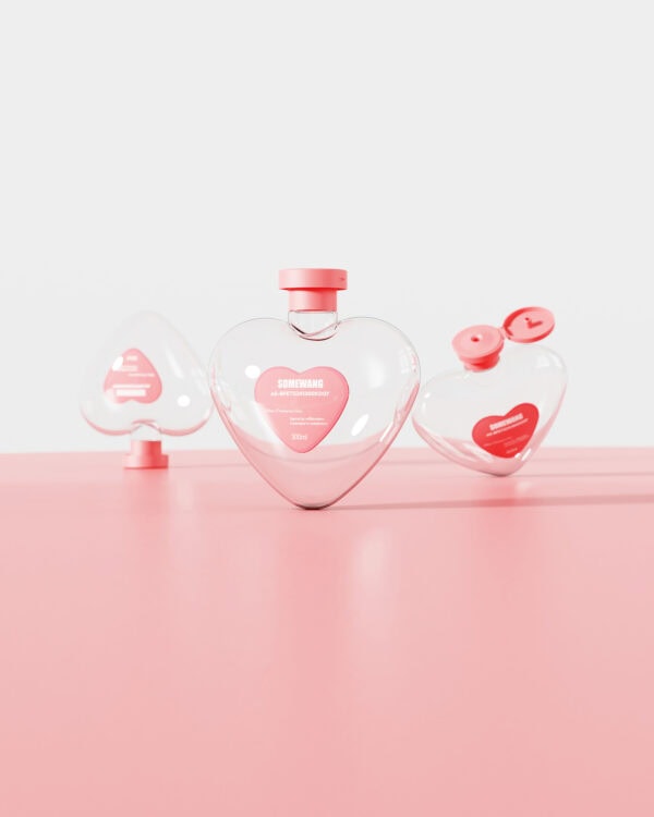 Clear glass heart-shaped perfume bottles with pink caps, featuring pink heart labels, styled on a pastel pink surface, exuding a cute and romantic aesthetic suitable for fragrance branding.