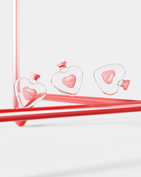 Stylish heart-shaped perfume bottles with pink caps display modern design and elegance for luxury fragrance branding.