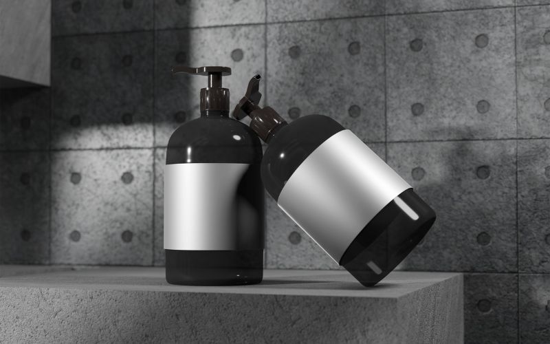 Stylish black and silver soap dispenser with pump and lid, perfect for modern bathroom or kitchen organization and hygiene essentials.